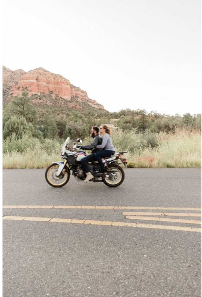 Sedona Engagement Session - couple on a motorcycle surrounded by red rocks